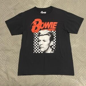 The brand is Bowie, 100% cotton, offically licensed
